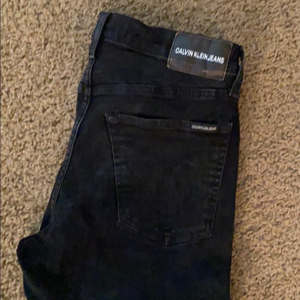 Black Calvin Klein jeans